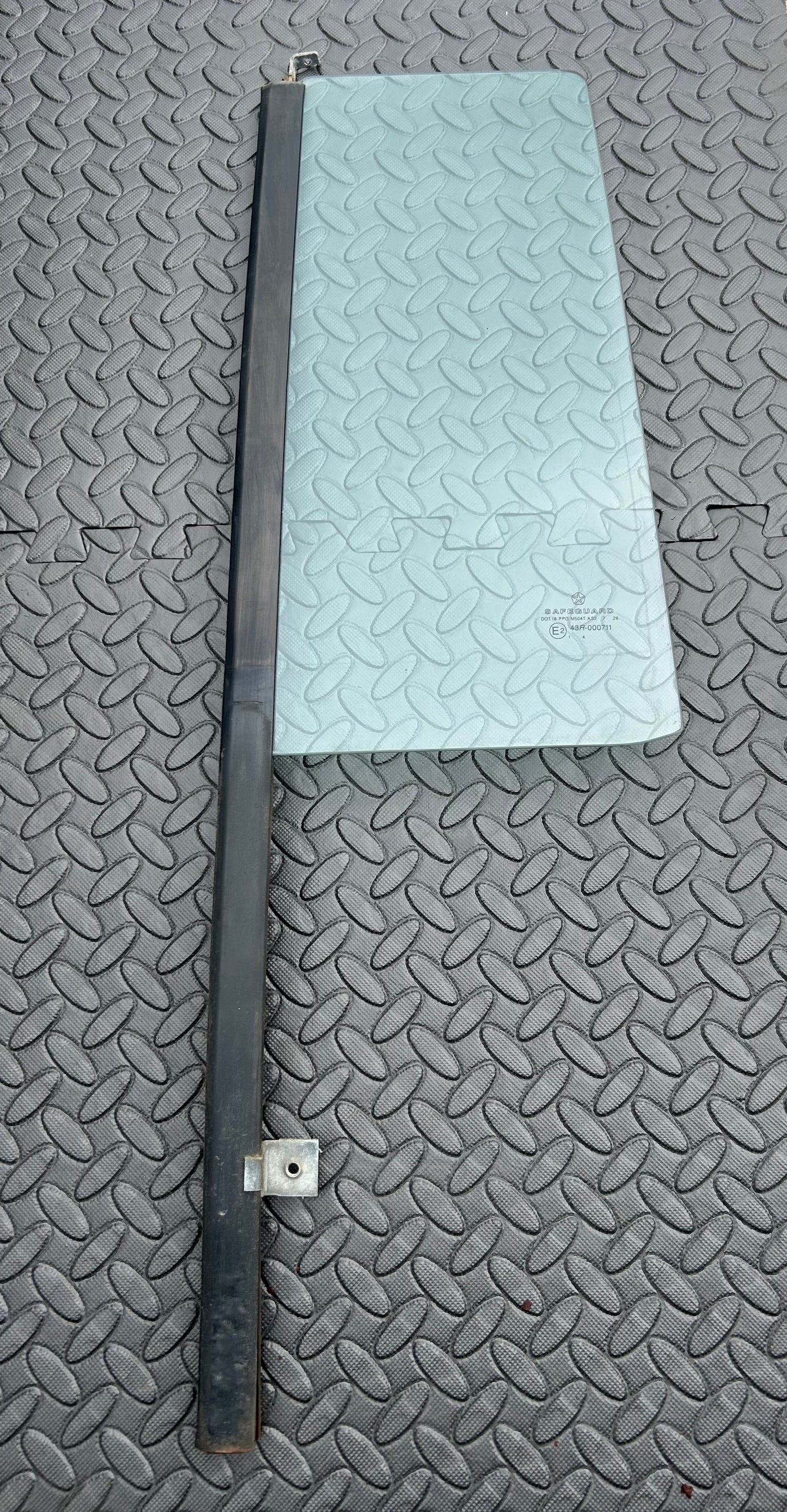 Passenger side rear fixed door glass